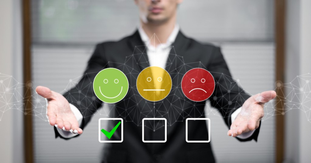 A person showing customer satisfaction survey example with emojis and checkbox