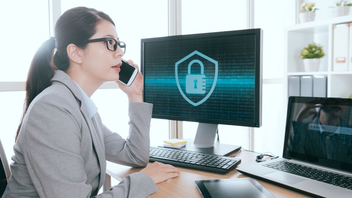 Woman using computer showcases digital brand protection by online brand protection companies